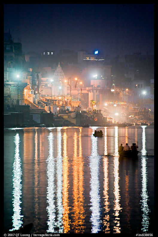 Lights reflected in the Ganga River at night. Varanasi, Uttar Pradesh, India