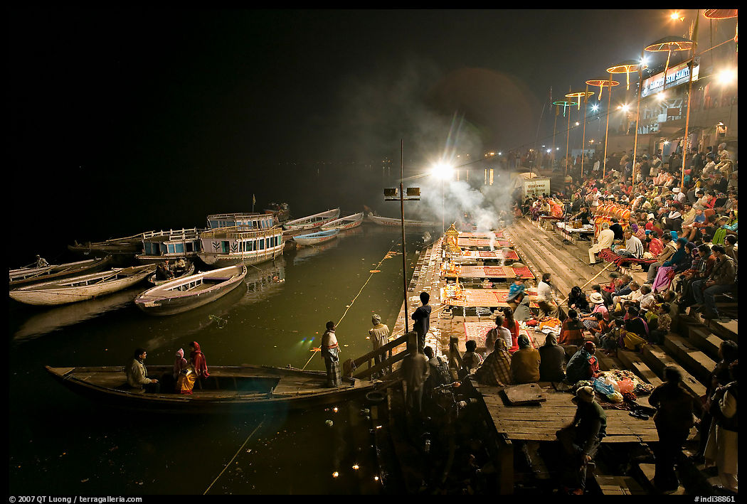 Boat and Dasaswamedh Ghat at the start of evening puja. Varanasi, Uttar Pradesh, India