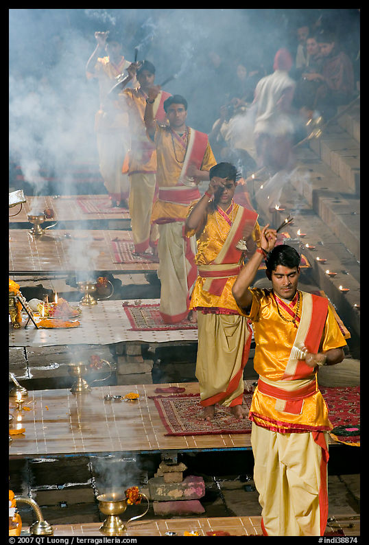 Five young Brahmans performing puja ceremony in the evening. Varanasi, Uttar Pradesh, India