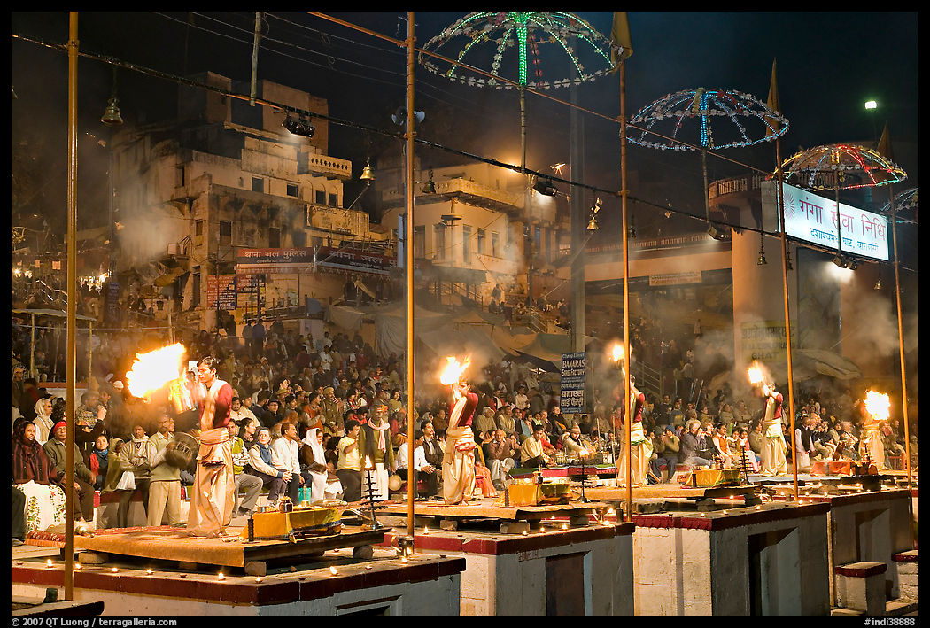 Pujari (priests) performing arti ceremony in front of large attendance. Varanasi, Uttar Pradesh, India