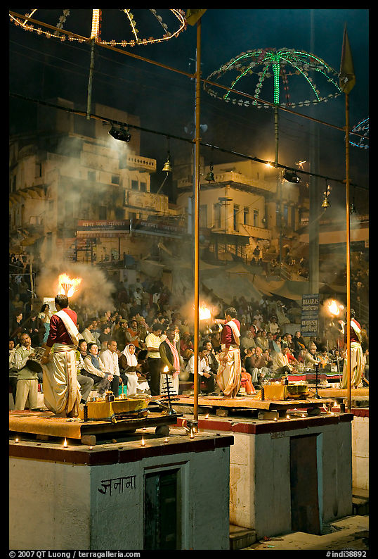 Holy hindu men facing audience during evening arti ceremony. Varanasi, Uttar Pradesh, India