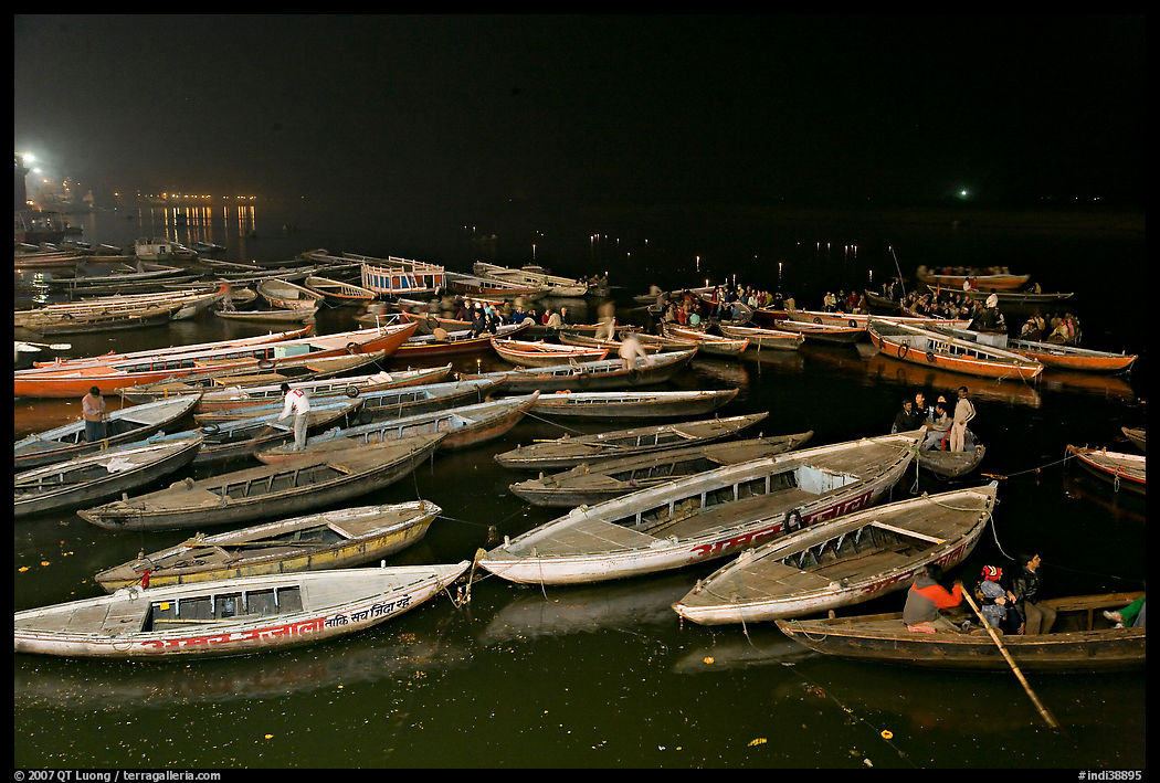 Boats on the Ganges River at night during arti ceremony. Varanasi, Uttar Pradesh, India