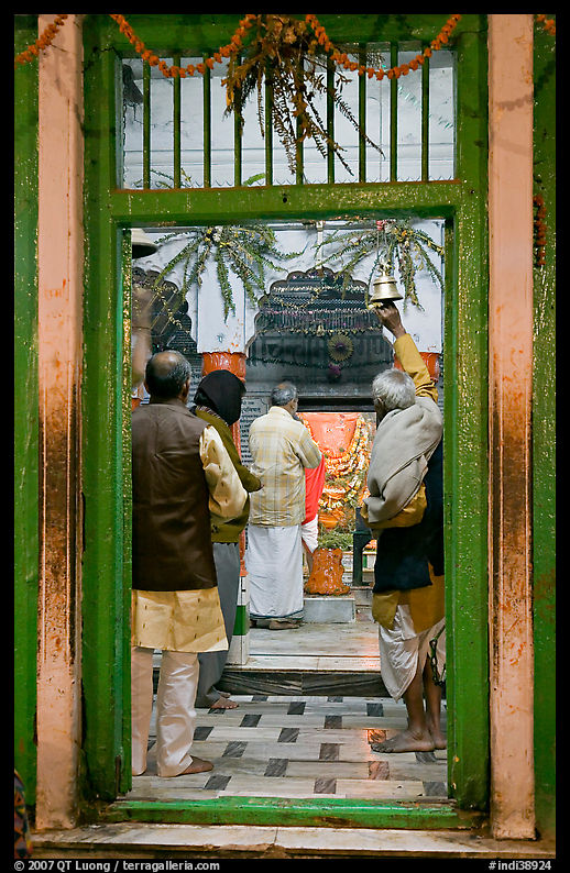 Bell ringing during worship in temple. Varanasi, Uttar Pradesh, India