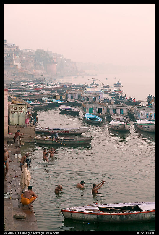 Pilgrims taking a holy dip in the Ganga River at dawn. Varanasi, Uttar Pradesh, India