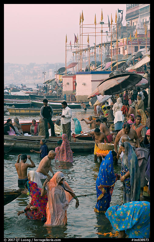 Women standing in Ganga River at sunrise, Dasaswamedh Ghat. Varanasi, Uttar Pradesh, India