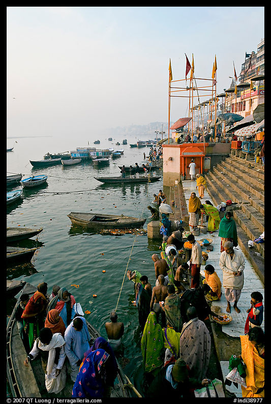 Boat unloading pilgrim onto Dasaswamedh Ghat, early morning. Varanasi, Uttar Pradesh, India
