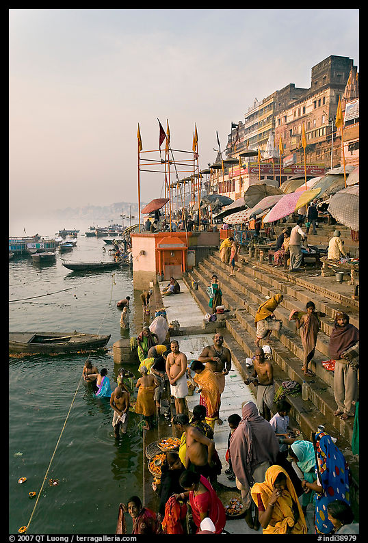 People about to bathe in the Ganga River at sunrise. Varanasi, Uttar Pradesh, India