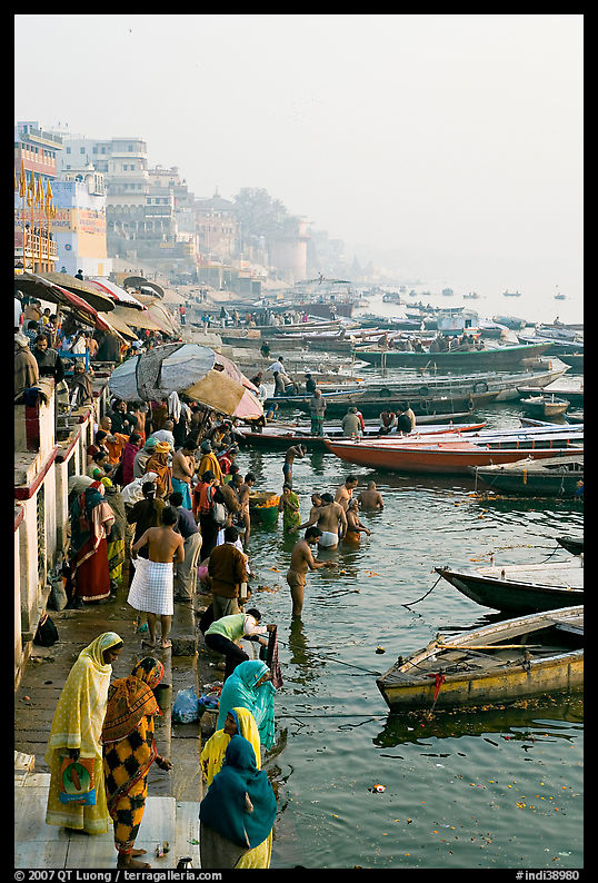 People and boats on the banks of the Ganges River, Dasaswamedh Ghat. Varanasi, Uttar Pradesh, India