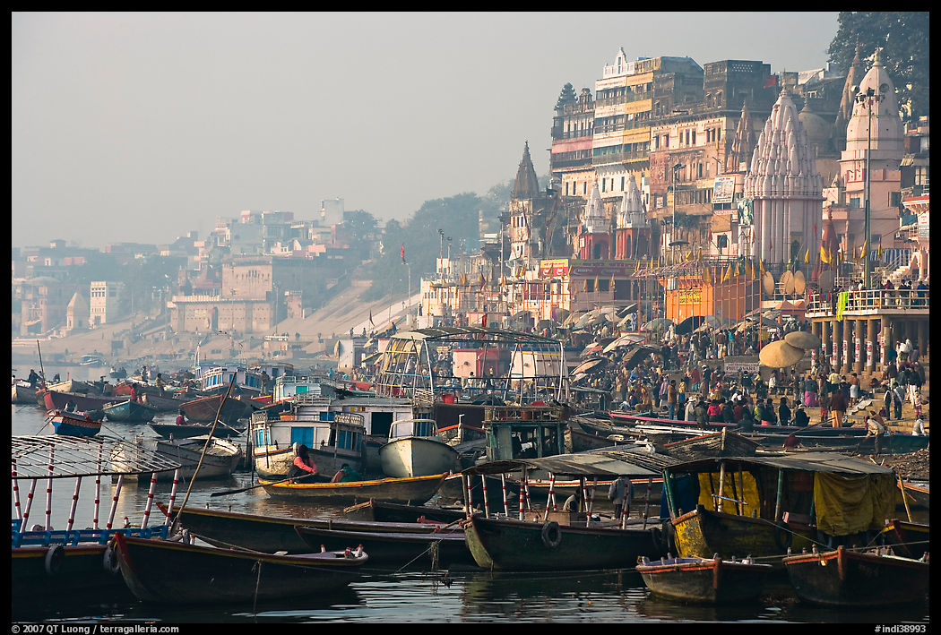 Boats and temples of Dasaswamedh Ghat, sunrise. Varanasi, Uttar Pradesh, India