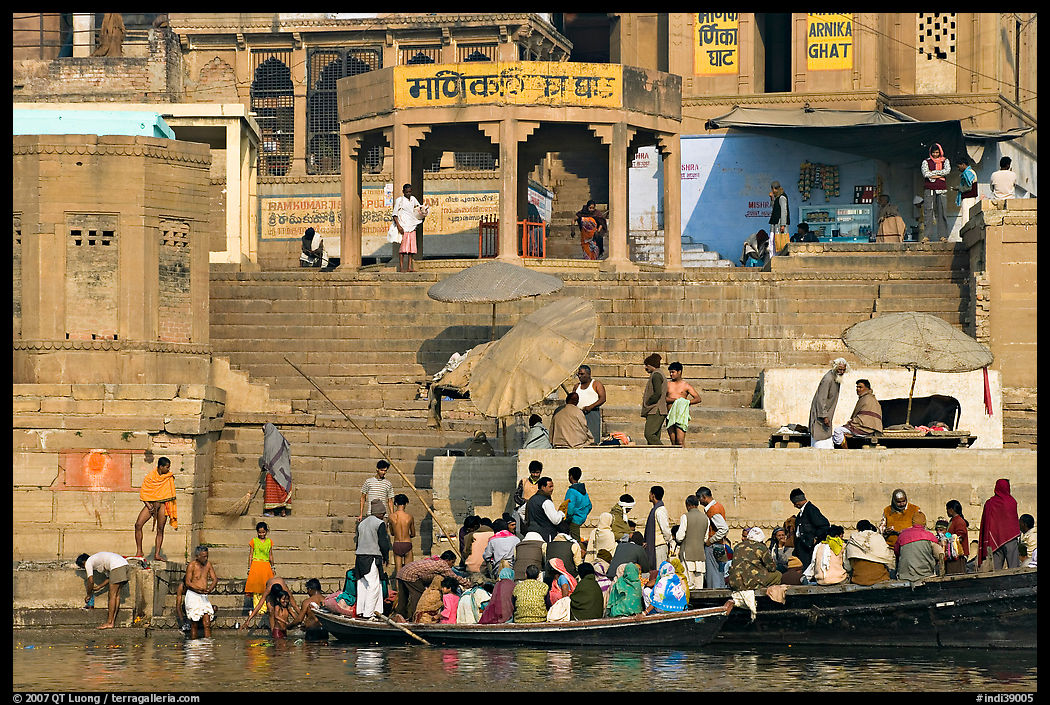 Boats loaded with pilgrims and steps, Manikarnika Ghat. Varanasi, Uttar Pradesh, India