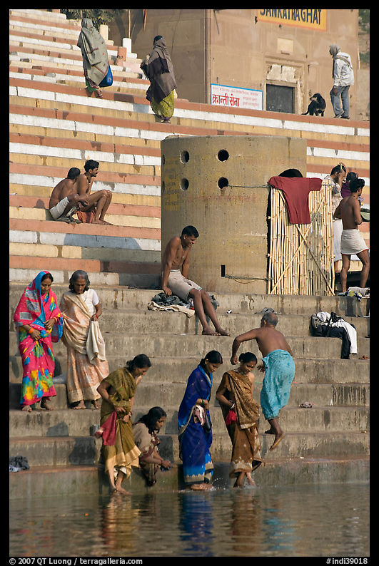 Women dipping feet in Ganga water at Sankatha Ghat. Varanasi, Uttar Pradesh, India