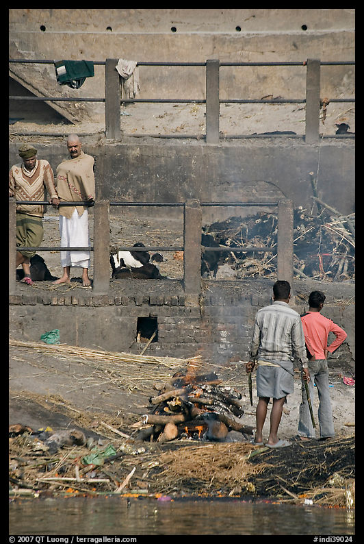Men attending to cremation, Manikarnika Ghat. Varanasi, Uttar Pradesh, India