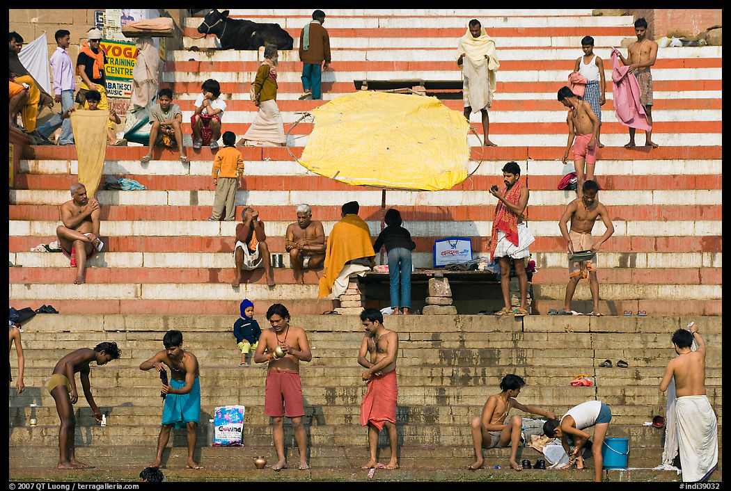 Men after bath on steps of Meer Ghat. Varanasi, Uttar Pradesh, India
