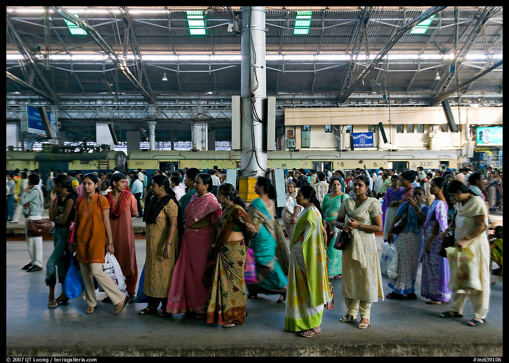 Women on train platform, Victoria Terminus. Mumbai, Maharashtra, India