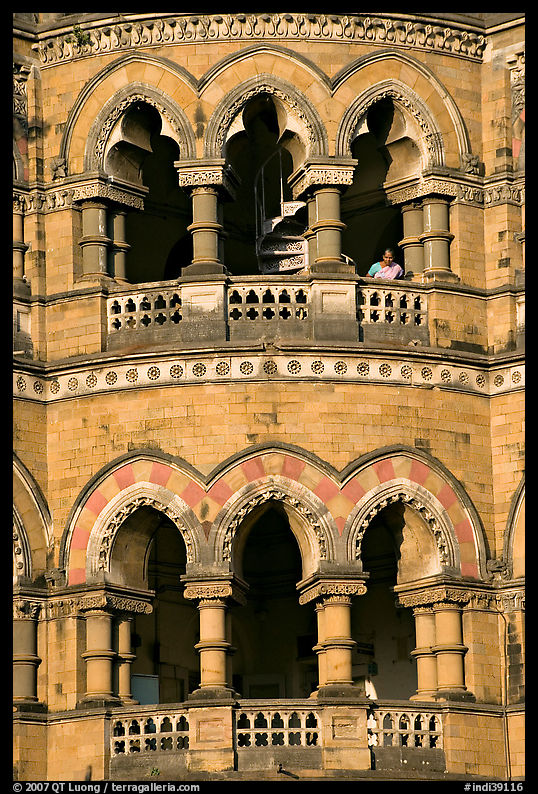 Facade with woman at window, Chhatrapati Shivaji Terminus. Mumbai, Maharashtra, India