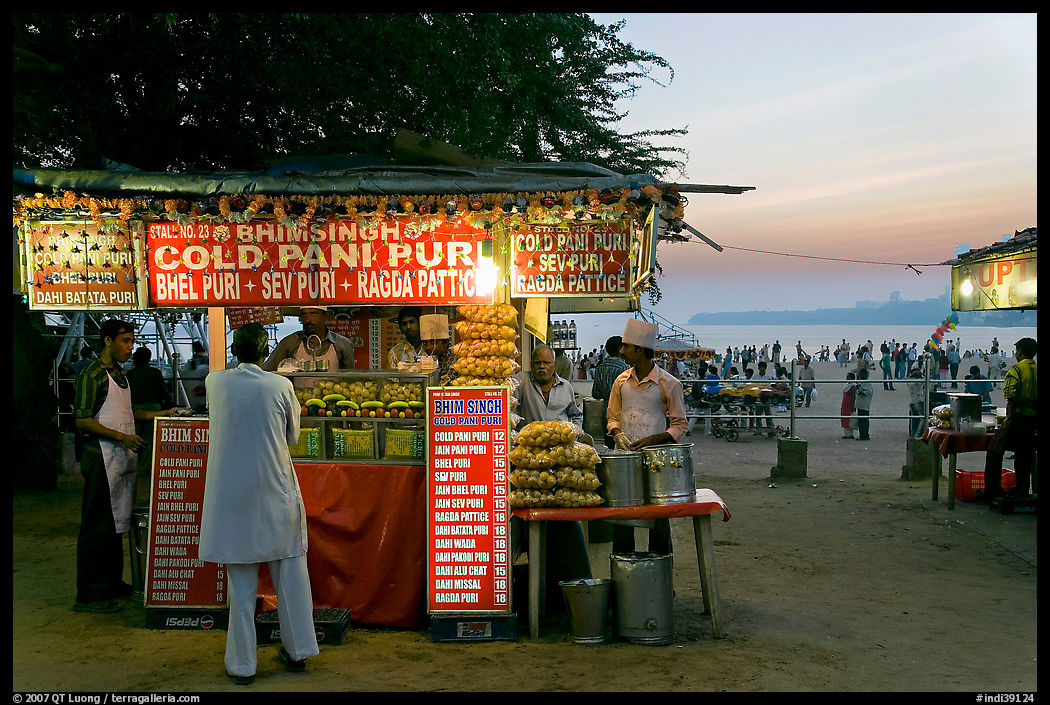 Food kiosks at sunset, Chowpatty Beach. Mumbai, Maharashtra, India