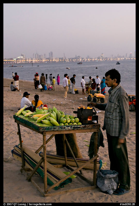 Food vendor on beach at dusk, Chowpatty Beach. Mumbai, Maharashtra, India