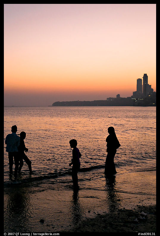Beachgoers and skyline, Chowpatty Beach. Mumbai, Maharashtra, India