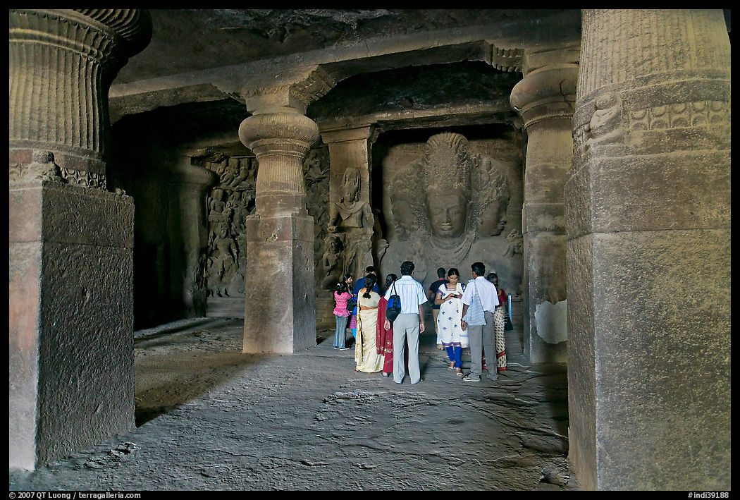 Vistors in main cave, Elephanta Island. Mumbai, Maharashtra, India