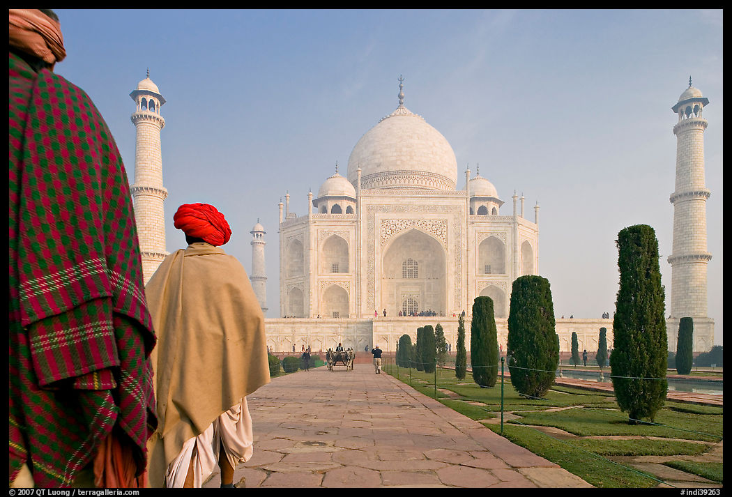 Men with turbans walking toward Taj Mahal, early morning. Agra, Uttar Pradesh, India