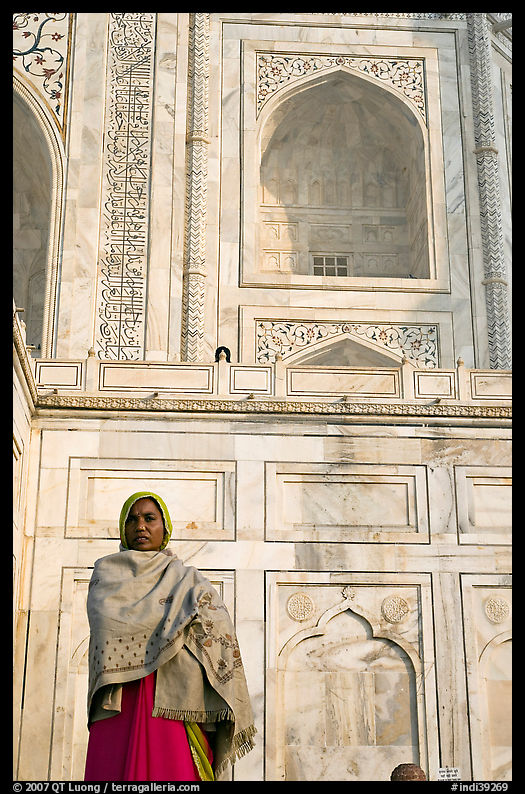 Woman standing at the base of Taj Mahal. Agra, Uttar Pradesh, India