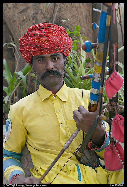Musician with string instrument. Agra, Uttar Pradesh, India