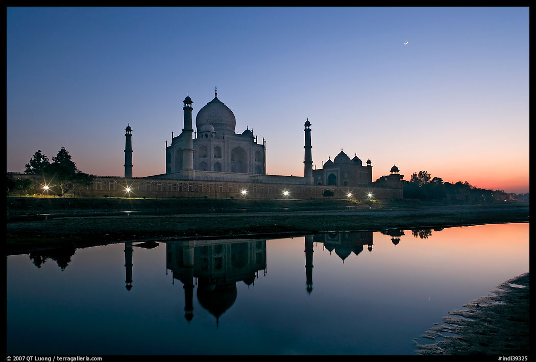 Taj Mahal complex reflected in Yamuna River at sunset. Agra, Uttar Pradesh, India