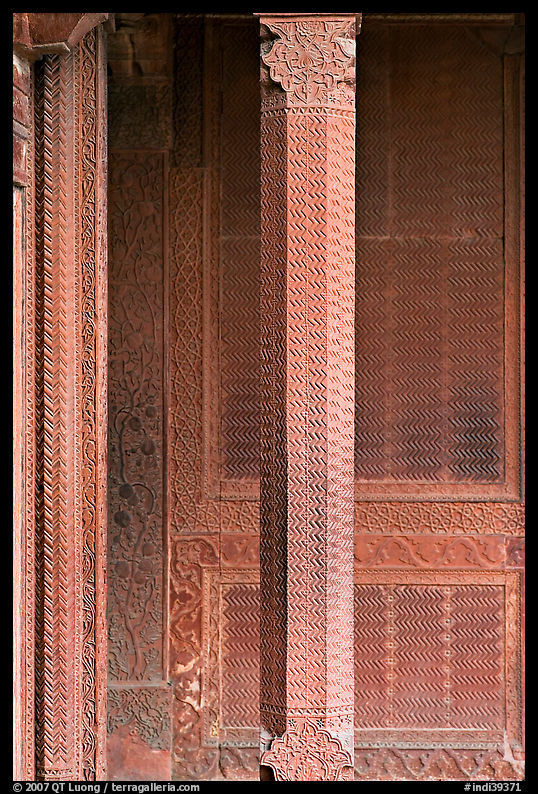 Carved columns and wall of the Rumi Sultana building. Fatehpur Sikri, Uttar Pradesh, India