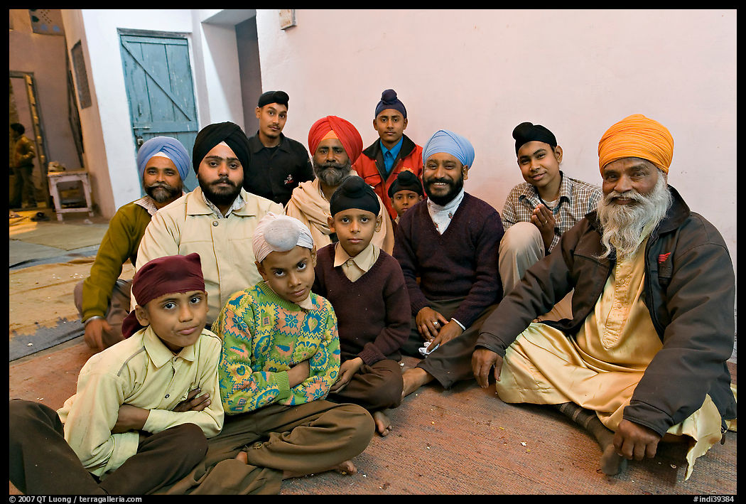 Sikh men and boys in gurdwara. Bharatpur, Rajasthan, India
