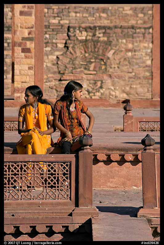 Young women sitting in the center of Ornamental pool. Fatehpur Sikri, Uttar Pradesh, India