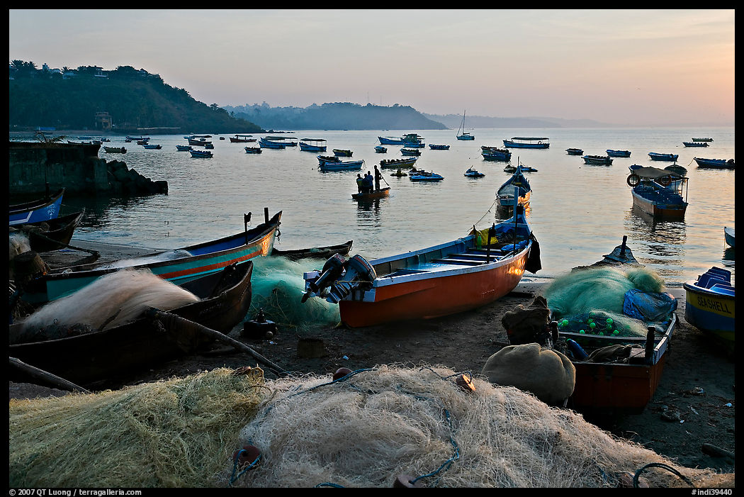 Fishing nets and boats, sunrise. Goa, India