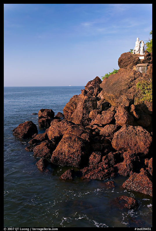 Boulders and christian statues overlooking ocean, Dona Paula. Goa, India
