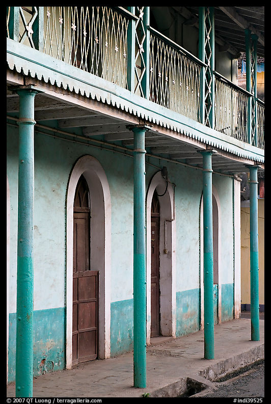 House with balconies painted green, Panjim. Goa, India