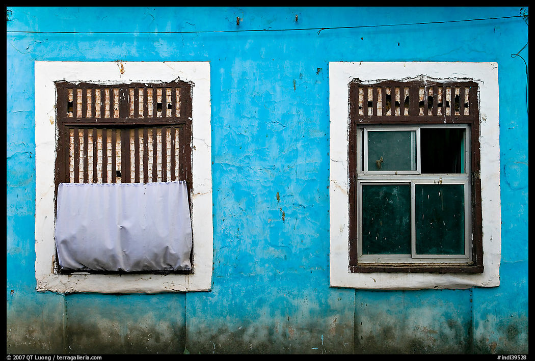 Windows on facade painted blue, Panjim. Goa, India