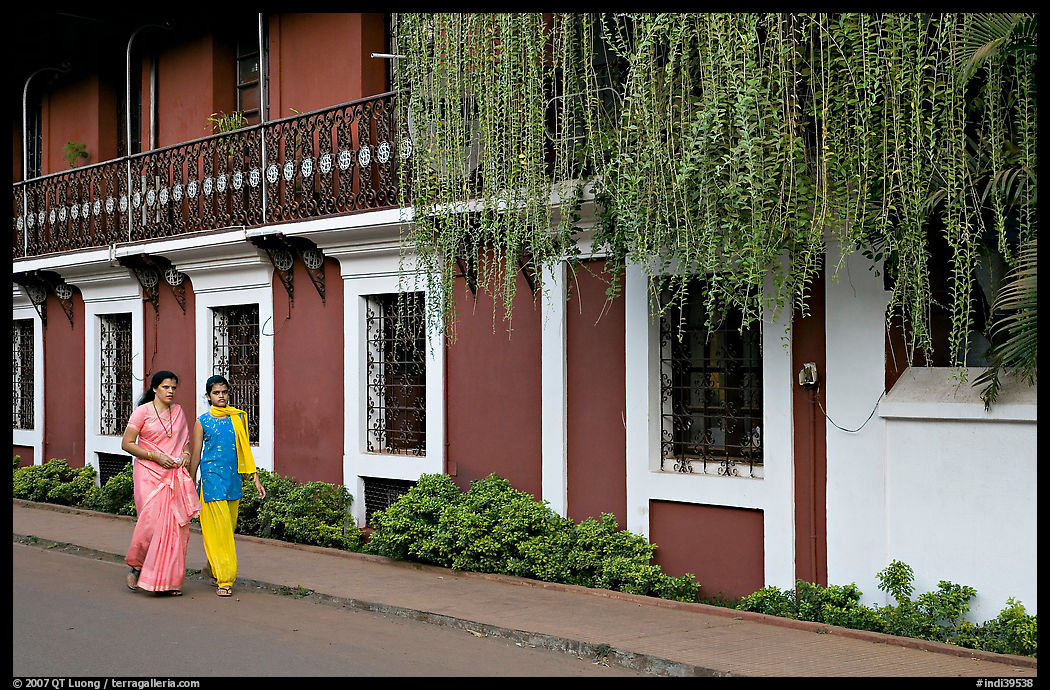 Women strolling past the heritage Panaji Inn, Panjim. Goa, India