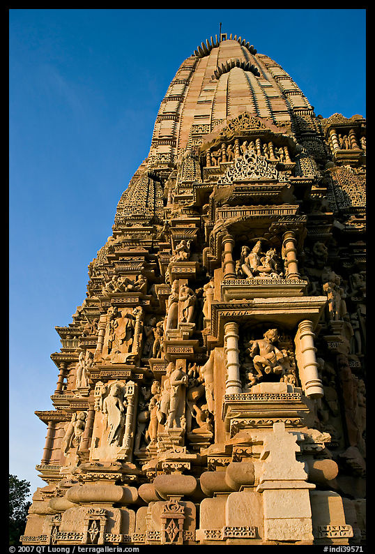 Bands of carved sculptures below spire (sikhara), Javari Temple, Eastern Group. Khajuraho, Madhya Pradesh, India