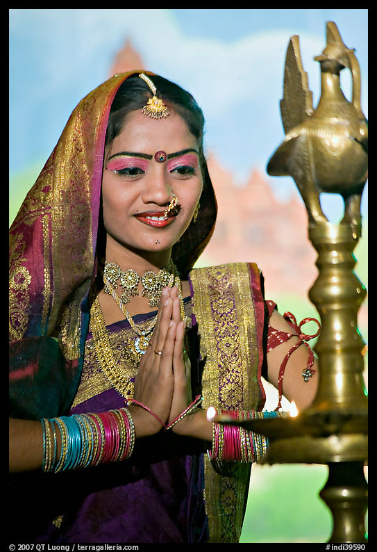 Woman joining hands in prayer gesture, Kandariya show. Khajuraho, Madhya Pradesh, India