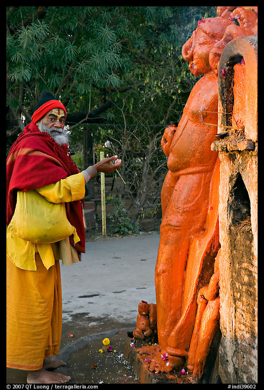 Holy man worshiping Shiva image. Khajuraho, Madhya Pradesh, India