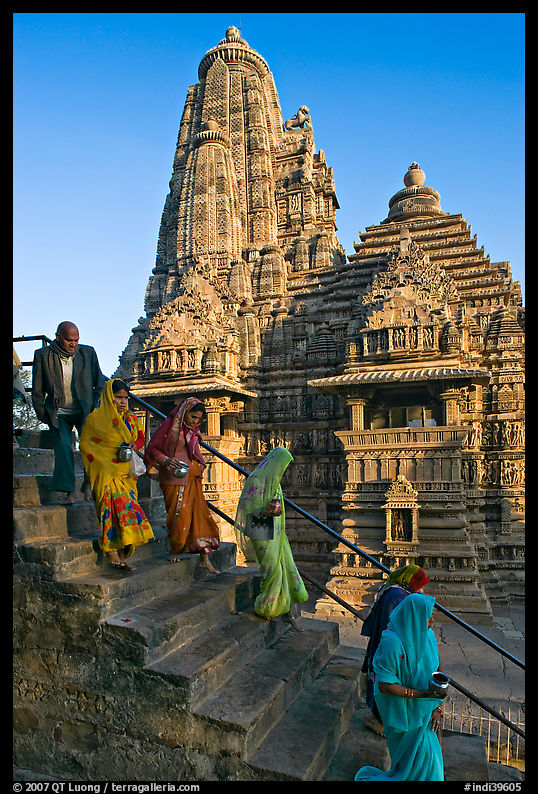 Worshipers going down stairs in front of Lakshmana temple. Khajuraho, Madhya Pradesh, India