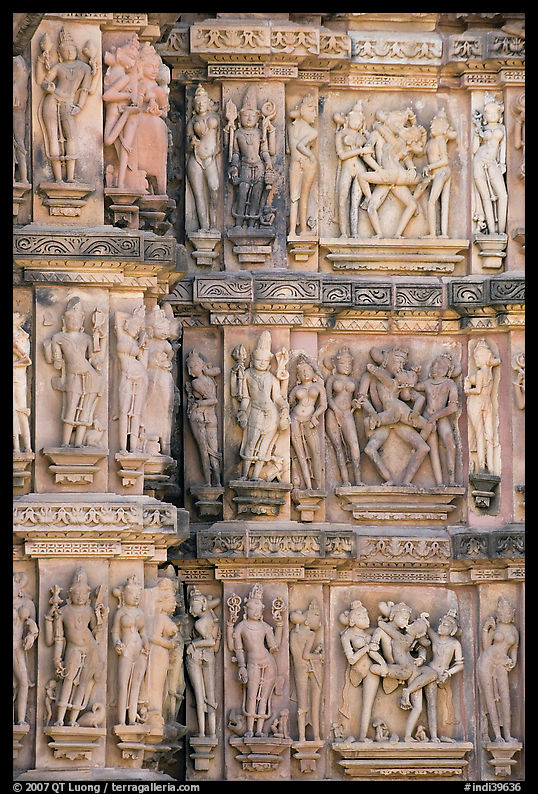 Carvings on the outside of Kadariya-Mahadeva temple including erotic figures. Khajuraho, Madhya Pradesh, India