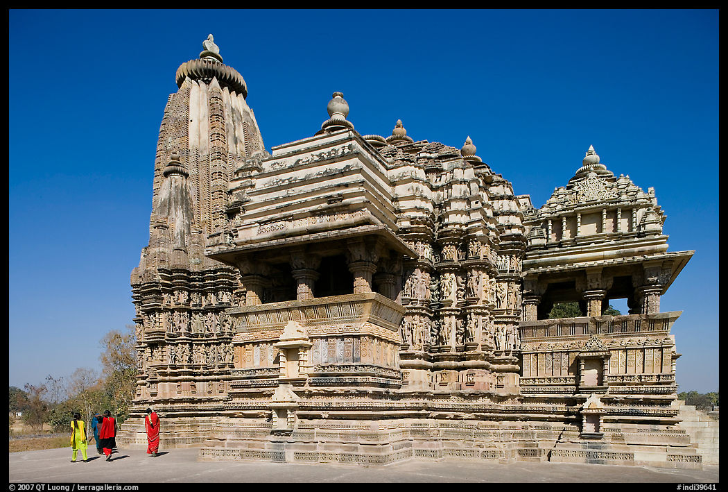 Devi Jagadamba temple with women walking. Khajuraho, Madhya Pradesh, India