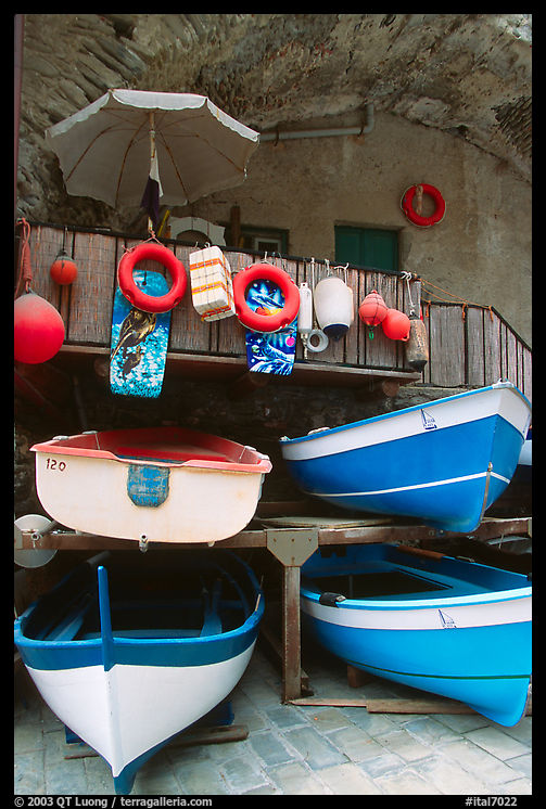 Tiny fishing boats stacked in the main square, Riomaggiore. Cinque Terre, Liguria, Italy