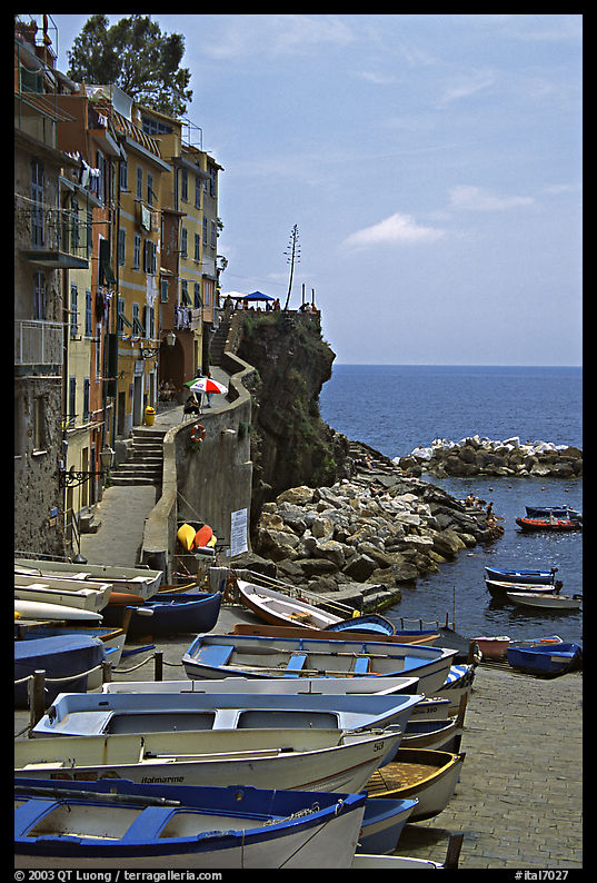 Fishing boats stacked in the small main square of the town, Riomaggiore. Cinque Terre, Liguria, Italy
