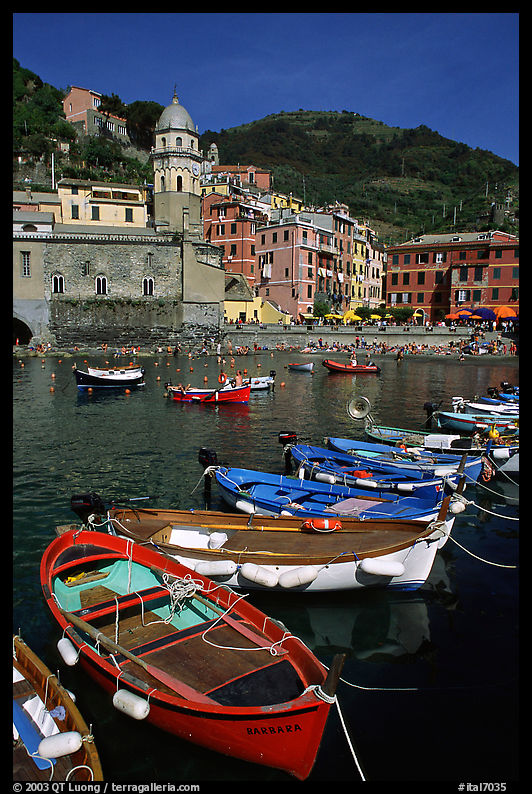 Colorful fishing boats in the harbor and main plaza, Vernazza. Cinque Terre, Liguria, Italy