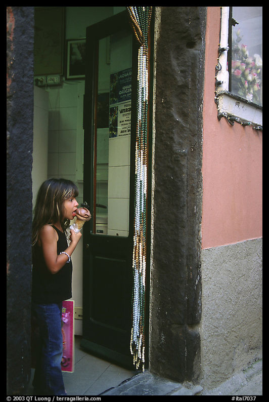 Girl enjoying gelato (ice-cream), Vernazza. Cinque Terre, Liguria, Italy