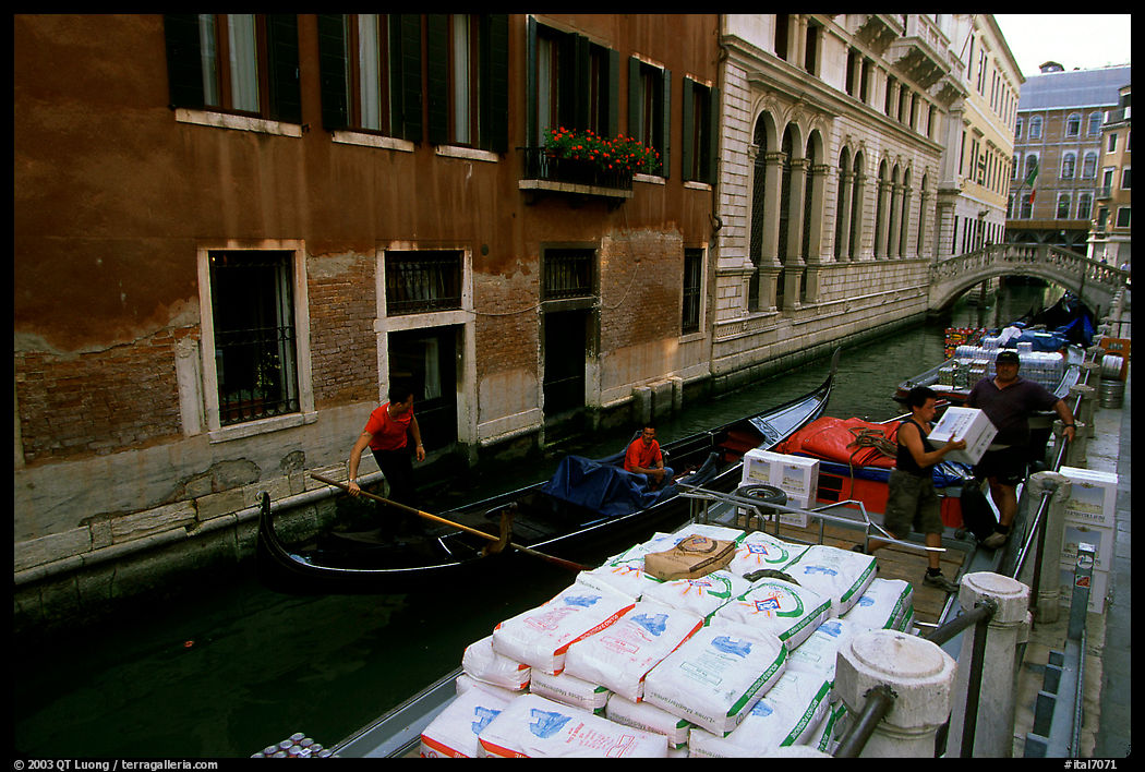 Delivery through a little canal. Venice, Veneto, Italy