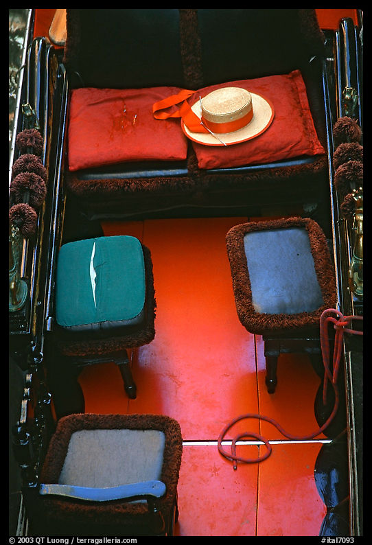 Empty gondola with seats and gondolier's hat. Venice, Veneto, Italy