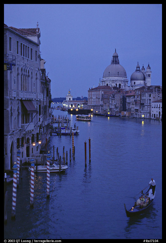 Gondola, Grand Canal, Santa Maria della Salute church from the Academy Bridge, dusk. Venice, Veneto, Italy