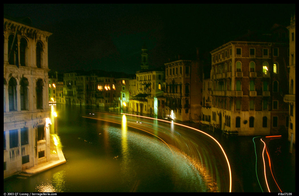 Light trails on the Grand Canal at night near the Rialto Bridge. Venice, Veneto, Italy