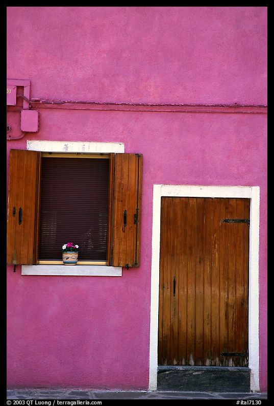 Door, window, pink-colored house,  Burano. Venice, Veneto, Italy
